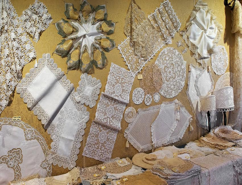 Discover what to buy in Italy and bring home the best Italy souvenirs — from olive oil and Murano glass to Limoncello, leather bags, and artisan gifts from Rome, Florence, and Venice. Burano lace. What to buy in Italy. Italian Souvenirs from Italy