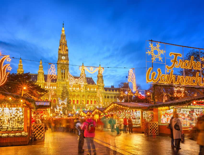 vienna best christmas markets in europe at night with golden lights and histoic buidlings in background