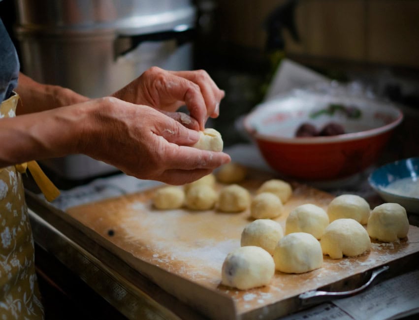 rolling knedle plum dumplings