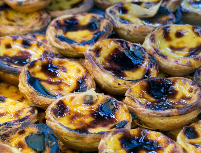 Iconic past&eacute;is de Bel&eacute;m fresh from the bakery, golden and caramelized, a must-eat in Lisbon."