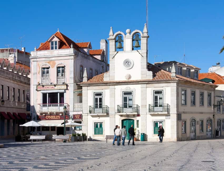 Golden sunset along the Cascais coastline, with sandy beaches, marina views, and charming seaside streets.