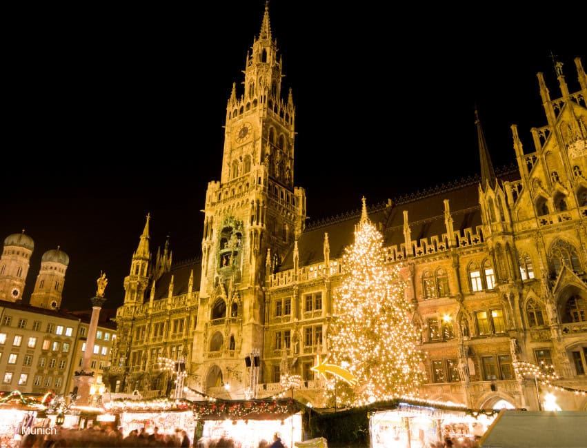 Christmas market at Munich's historic city hall with festive lights and holiday decorations.