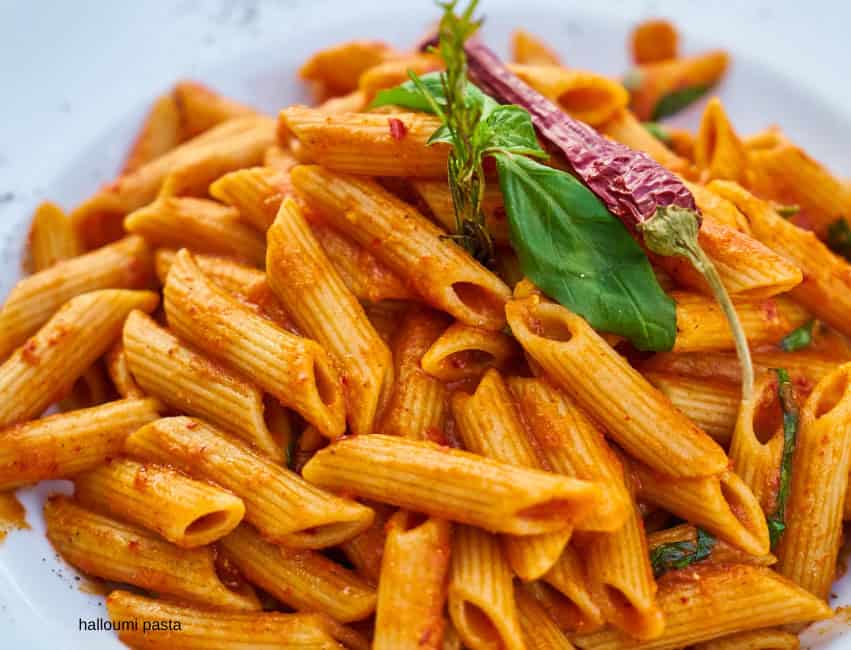 Spicy chili garlic halloumi pasta with red pepper flakes and seared halloumi pieces