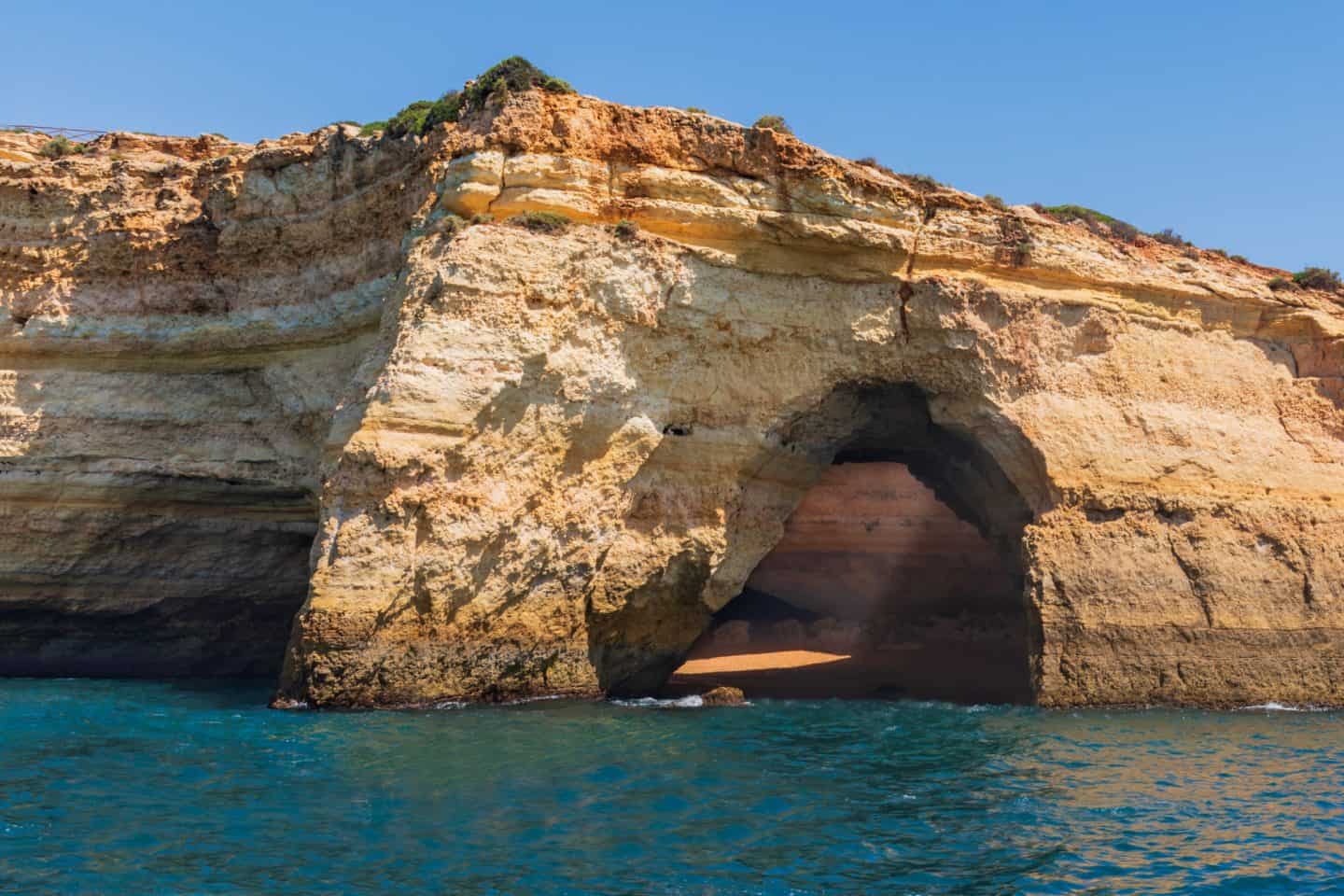 Explore the incredible Benagil Caves in Algarve, Portugal. Discover its history, how to get there, the best Benagil Cave tours, nearby beaches, hotels, and travel tips for your visit to the world-famous Algar de Benagil.