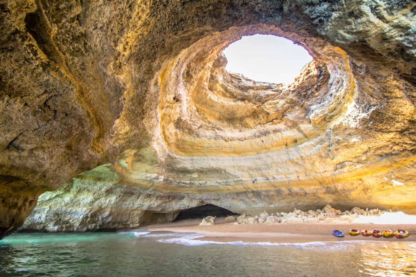 Explore the incredible Benagil Caves in Algarve, Portugal. Discover its history, how to get there, the best Benagil Cave tours, nearby beaches, hotels, and travel tips for your visit to the world-famous Algar de Benagil.