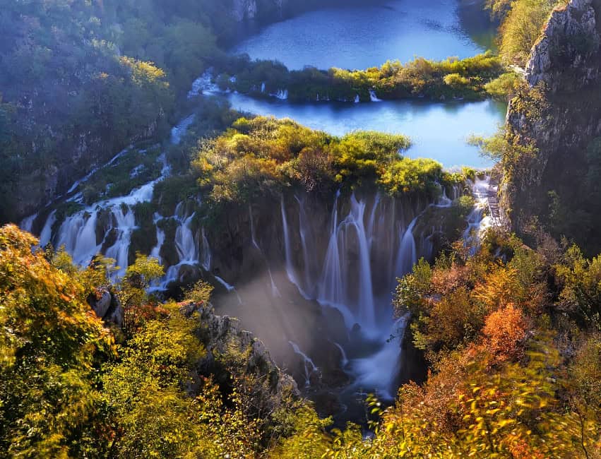 Golden autumn leaves reflecting on Plitvice Lakes in Croatia