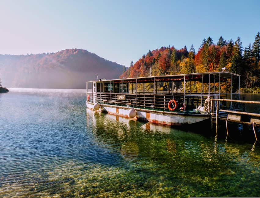 Plitvice lakes croatia waterfalls boat in colourful fall colours