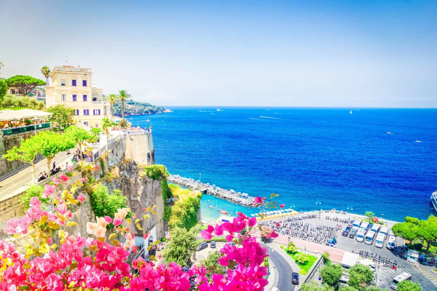 Aerial view of Sorrento Italy cliffs, Marina Grande, and the Bay of Naples at sunset &ndash; things to do in Sorrento
Sorrento Italia or Sorrentina Italy)