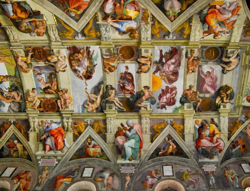 Visitors admiring Michelangelo’s frescoes inside the Sistine Chapel in winter. Rome in winter.