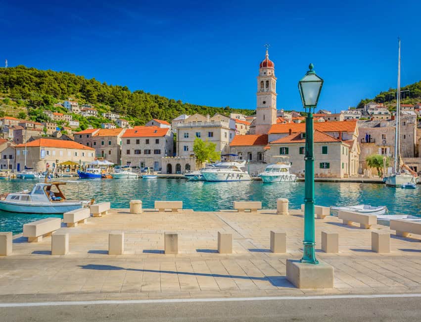 Pucisca Brac Croatia white stone village overlooking calm turquoise bay