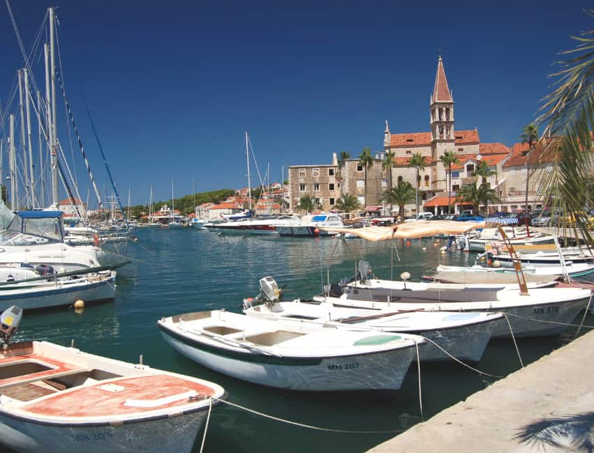 Milna Brac Croatia marina with yachts and pine-covered hills