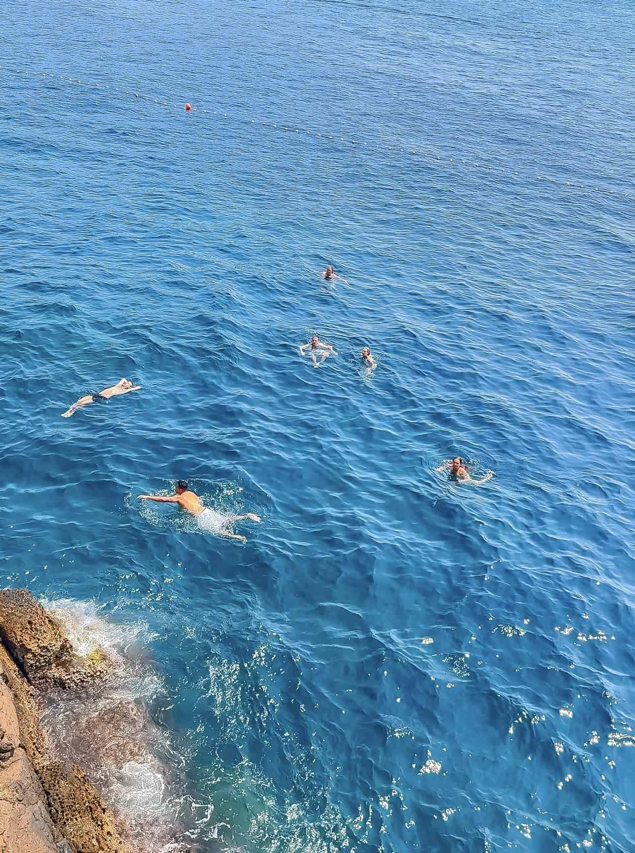 Visitors can cool off with a swim in the Adriatic Sea directly below Buža Bar Dubrovnik. The cave bar’s cliffside location provides stunning views and access to pristine, inviting waters.