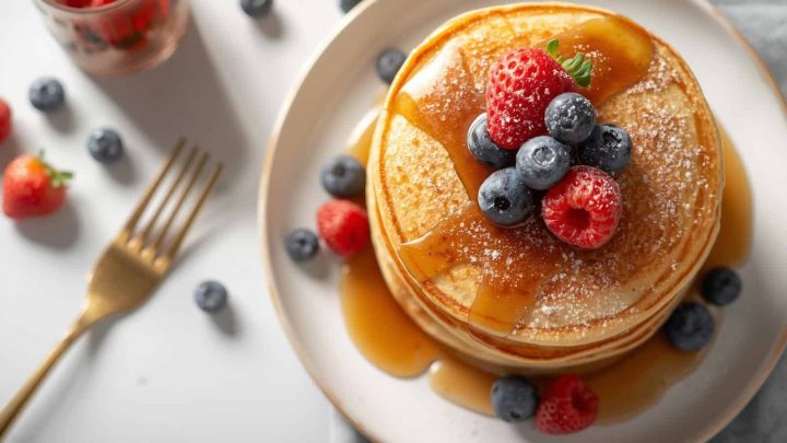 Make fluffy high protein pancakes with protein powder and oats. Easy protein pancakes recipe with exact macros, perfect for healthy breakfasts and fitness goals.
