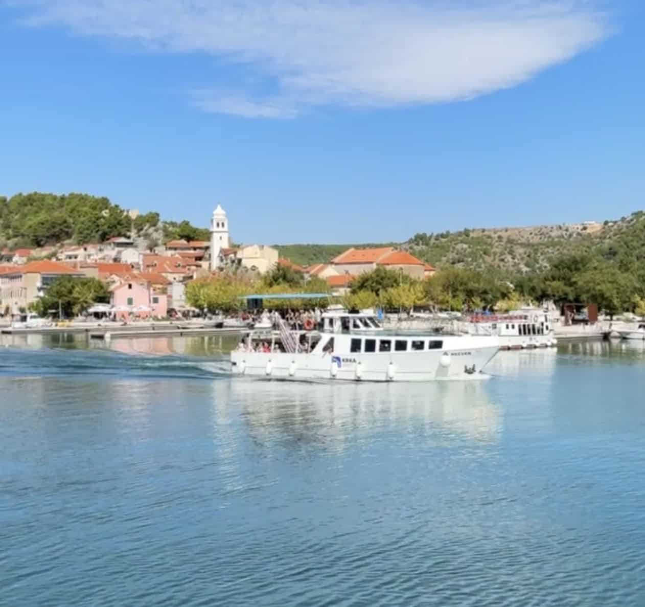 boat from krka waterfalls to skradin view of city and boat
