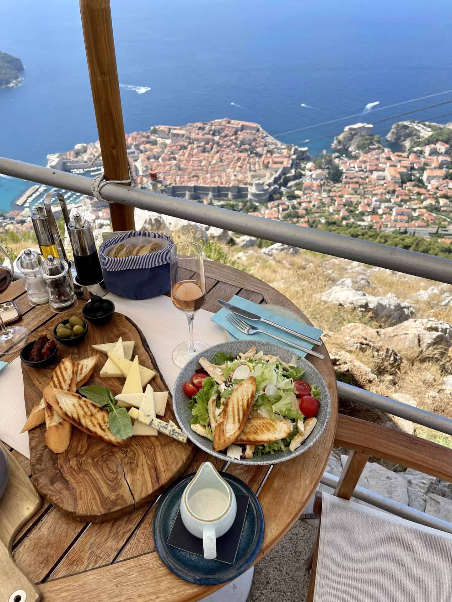 table of lunch at panorama restaurant dubrovnik with views of dubrovnik cable car and old town dubrovnik
