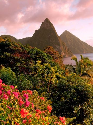 St Lucia Pitons rising above the Caribbean Sea at sunset best caribbean islands to visit